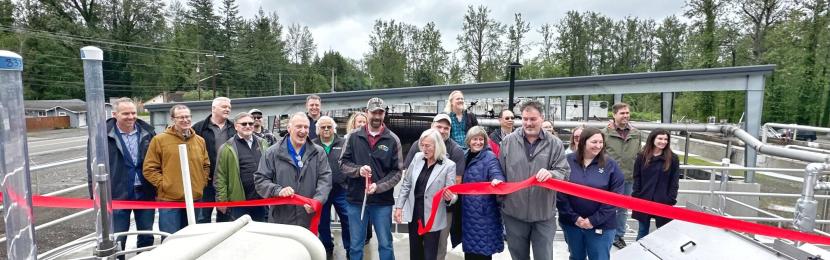 Ribbon cutting at the North Bend wastewater treatment plant drew a crowd of employees.